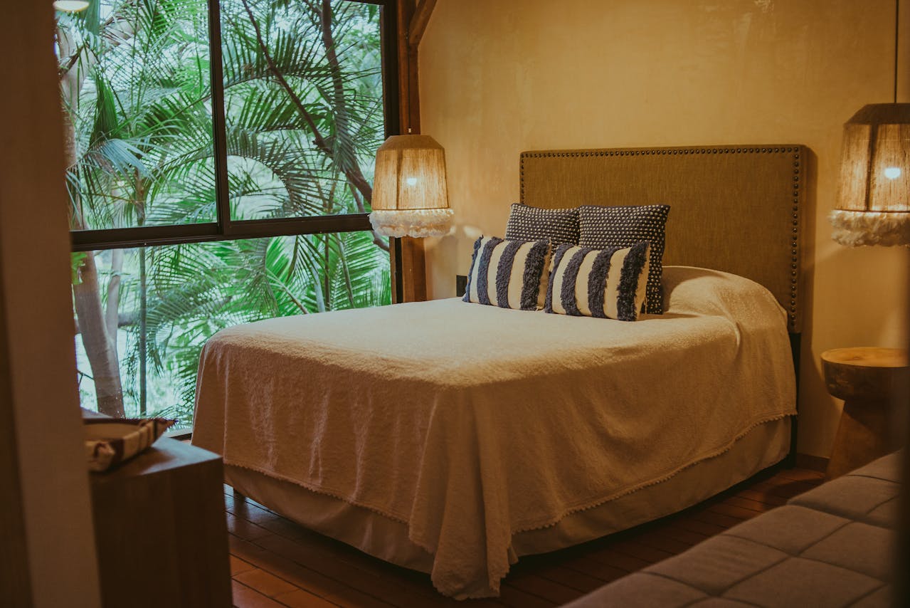 bedroom with warm tone covers on bed