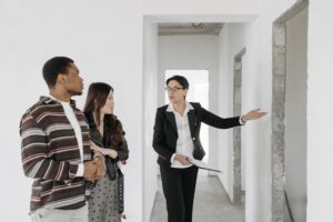 person showing two people walls in house